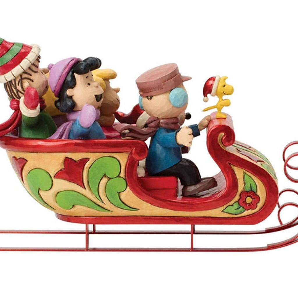 Estatua de Snoopy y sus amigos en un trineo: Por Jim Shore.